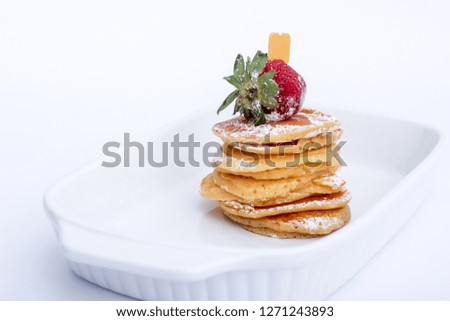 Strawberry Pancakes with Fresh Strawberry Garnish on Top
