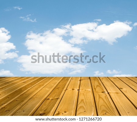 blue sky clouds with wooden walkway