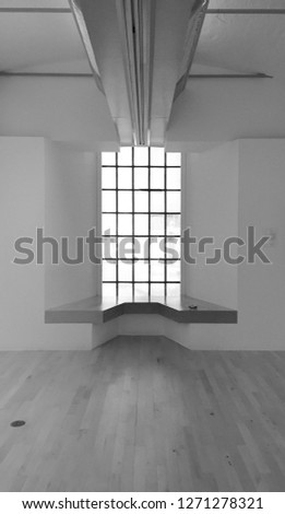 Black and white sitting area (seat, chair) with high window in Tate Modern Museum Liverpool at Royal Albert Dock Liverpool on Mersey river waterfront (Pier Head) in Liverpool, UK, Europe. March 2016.