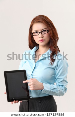 businesswoman pointing to the digital tablet
