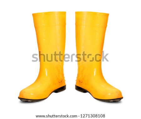 Yellow rubber boots isolated on white background. Dirty boots. ( Clipping path ) Royalty-Free Stock Photo #1271308108
