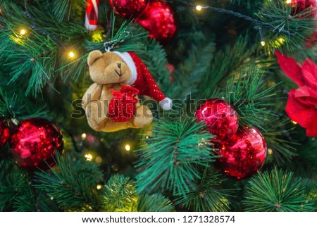 Golden and red decoration in the chrismas tree leaves artificial