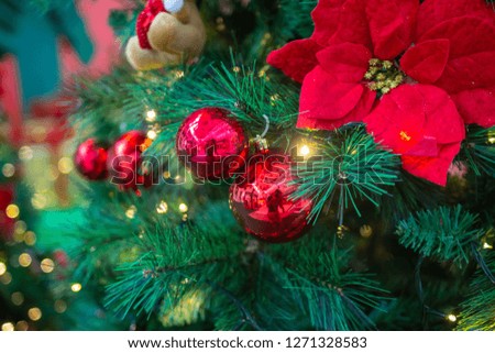 Golden and red decoration in the chrismas tree leaves artificial