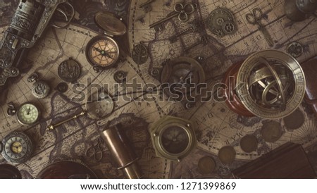Vintage Compass, Watch Pendant And Telescope On Old World Map	