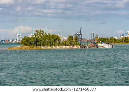 Beautiful landscape from Virginia Key of Luijo Island, South Channel and the Miami Downtown skyline. Blue sea and tropical islands.