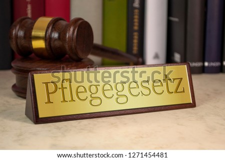 Golden sign with the german word for care law - pflegegesetz