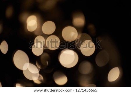 Golden bokeh effect on a dark background