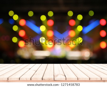Wood table or wood floor with abstract stage light bokeh background for product display