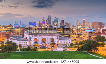 Kansas City, Missouri, USA downtown skyline with Union Station at dusk. 