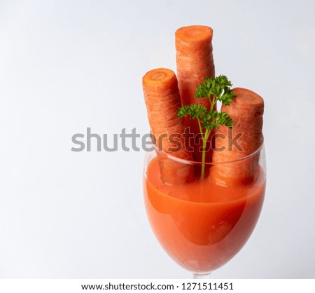 healthy, full of vitamins, spring juice of fresh carrot and parsley in a glass
