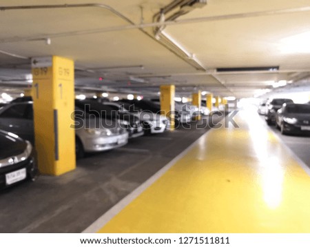 Underground parking/garage, Blurred of Many cars in the parking garage, Cars parked.