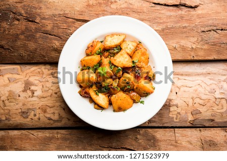 Masala fried Idlies - south indian Snack made using with leftover idly served with tomato ketchup. selective focus Royalty-Free Stock Photo #1271523979
