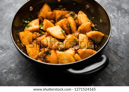 Masala fried Idlies - south indian Snack made using with leftover idly served with tomato ketchup. selective focus