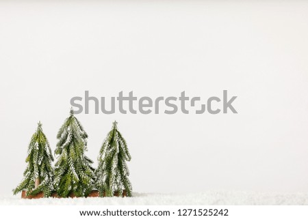 Three Pine Trees on a Simple White Background
