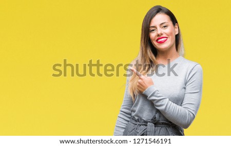 Young beautiful worker business woman over isolated background cheerful with a smile of face pointing with hand and finger up to the side with happy and natural expression on face