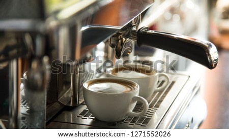 two black coffee morning on coffee maker