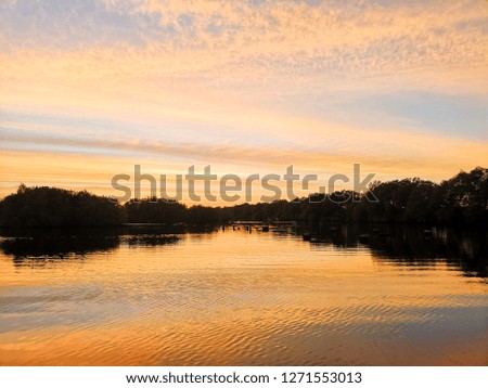 Good view of Vanilla sky reflection  river with tree around in Thailand.