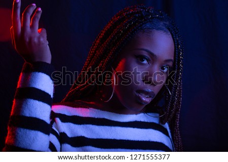 African American woman with Red and Blue studio lights