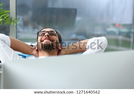 Handsome smiling bearded adult clerk person arms crossed up over head sit behind laptop pc display at office workplace desk portrait. Stress free home worker people optimistic cozy carefree pleasure Royalty-Free Stock Photo #1271640562