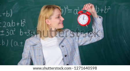 Always on time. Woman teacher hold alarm clock. She cares about discipline. Time to study. Welcome teacher school year. Looking committed teacher complement qualified workforce educators.