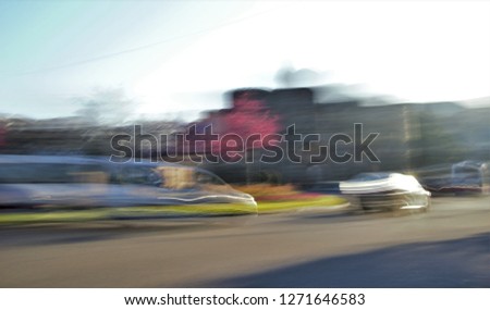 Tribute to Monet, tribute to Ernst Hass, impressionist photograph of moving vehicles, Toledo, Spain, photographic sweeps at low shutter speed, blurred background, motion sensation,  