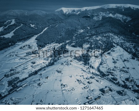 Beautiful aerial drone photo of Carpathian mountains. Winter landscape shot with flying camera. Carpathians in cold snowy day