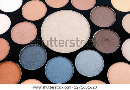 Palette of cosmetic eye shadow for make-up. Fashion and beauty background