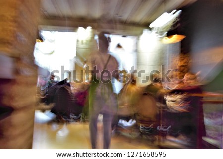 Tribute to Ernst Hass, Tribute to Monet, impressionist photograph of the people in drinking and alternating in bars of Toledo, Spain, photographic sweeps at low shutter speed, feeling of movement,