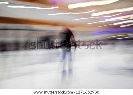 Tribute to Ernst Hass, Tribute to Monet, ghostly human figures  skating on ice, impressionist photography at low shutter speed to give a sense of movement and happiness,