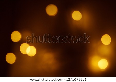 light background with orange color, circular reflections of Christmas lights, Bokeh lamp colorfull, Festive abstract background