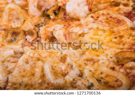 pizza with seafood top view close-up