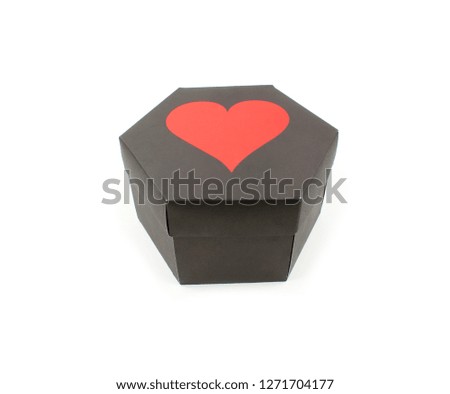 black colored hexagon gift box. have red heart sign on the cover of the box.