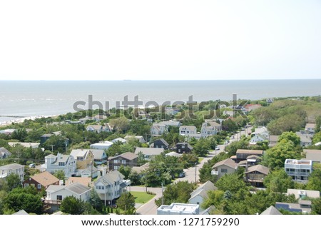An aerial shot of Cape May, a suburban beach town. This picture features an overhead image of the coast line with the ocean in sight.
