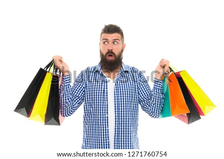 Choosing the best. Black Friday. Cyber Monday. Bearded man with shopping bags.. Shopping sale. Male barber care. Mature hipster with beard. surprised brutal caucasian hipster with moustache.