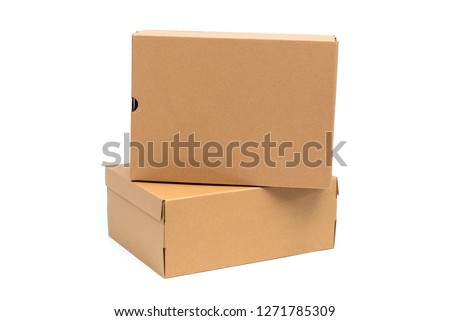 Brown cardboard shoes box with lid for shoe or sneaker product packaging mockup, isolated on white background with clipping path. Royalty-Free Stock Photo #1271785309