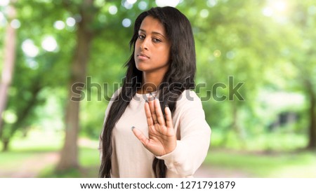 Young afro american woman making stop gesture denying a situation that thinks wrong at outdoors