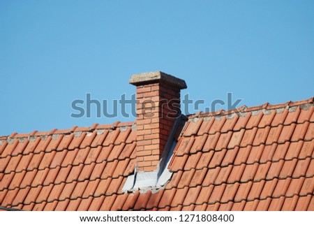 red brick chimney in the top of village house Royalty-Free Stock Photo #1271808400