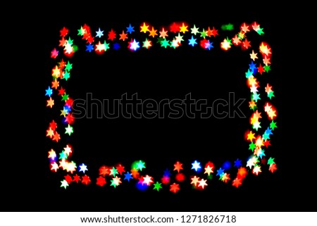 colorful stars form a frame.bokeh stars isolated on black background.frame of stars.