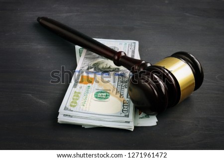 Gavel and money in the court. Penalty or bribe. Royalty-Free Stock Photo #1271961472
