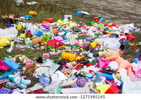 Pile of abandoned plastic children's toys for reuse and recycle. Selective focus Royalty-Free Stock Photo #1271985145