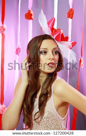 beautiful Valentines woman playful joyful and excited smiling holds heart balloon