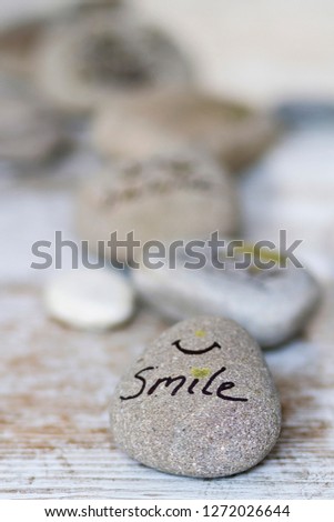 Round stones with wellness concepts writen on it