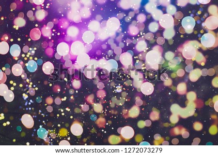 abstract blurred of blue and silver glittering shine bulbs lights background:blur of Christmas wallpaper decorations concept.xmas holiday festival backdrop:sparkle circle lit celebrations display