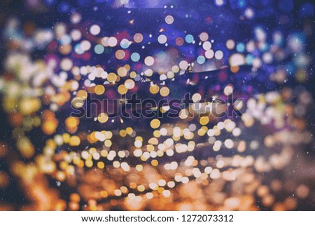 abstract blurred of blue and silver glittering shine bulbs lights background:blur of Christmas wallpaper decorations concept.xmas holiday festival backdrop:sparkle circle lit celebrations display