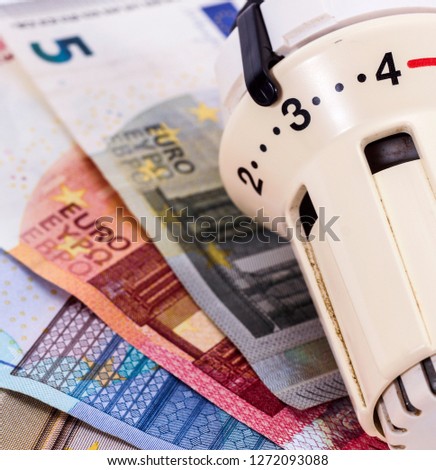 Thermostat with euro money - concept picture for heating costs