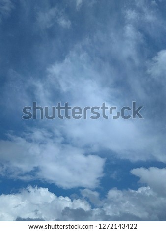 Photos of the sky, where white clouds float across the endless blue.