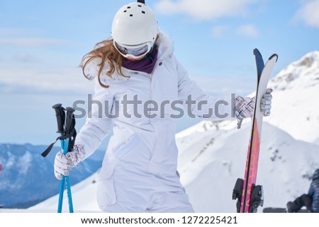                 Skier woman on the background of high mountain Winter sport.                
