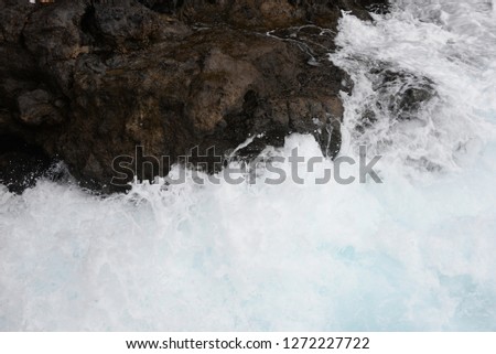 Surf, waves, gout, at the Atlantic Ocean at the volcanic island Tenerife, Spain