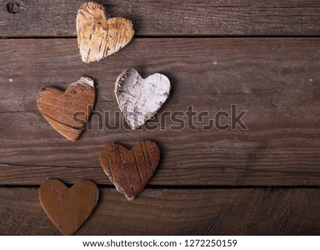 Love concept for mother's day and valentine's day.  hearts on wooden background with space for text