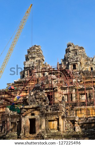 Tower crane in the temple of Angkor Wat. Reconstruction of the temple complex of the UNESCO.